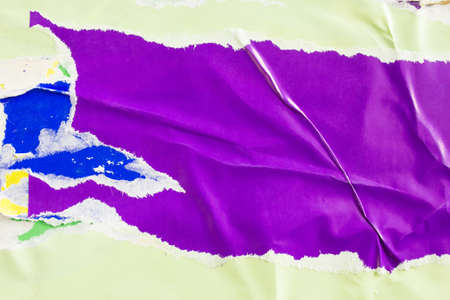 Purple and green torn and crumpled paper posters. Old dirty ripped and peeling grunge paper placards texture background. Copy space for text.の写真素材