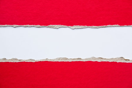 Red torn pieces of cardboard paper on white background. Copy space for text message.の写真素材