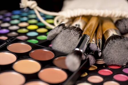 Vintage make-up brushes  on makeup paletteの写真素材