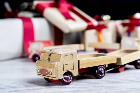 Close up of a vintage wooden truck with presents in the backgroundの写真素材
