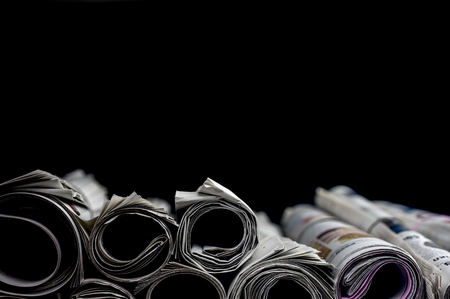Close up shot of rolled newspapersの写真素材