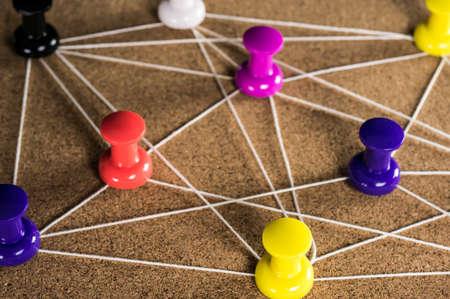 string placed on colorful pinsの写真素材