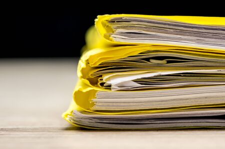 Macro shot of a pile of folders and files with paperworkの写真素材