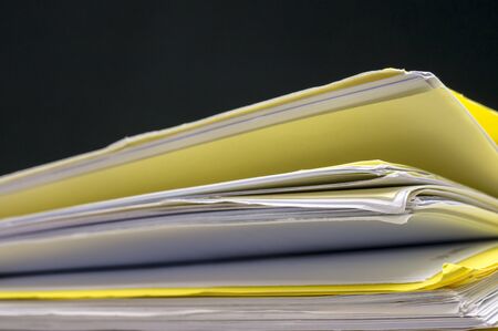 Macro shot of a pile of folders and files with paperworkの写真素材
