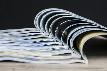 Close up shot of colorful magazines arranged togetherの写真素材