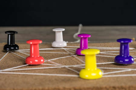 string placed on colorful pinsの写真素材