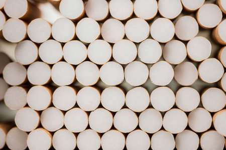 Close up shot of a pile of cigarettes backgroundの写真素材
