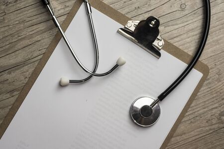 Close up shot of a stethoscope on a cilp padの写真素材