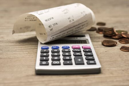 Close up shot of calculator and shopping receiptの写真素材