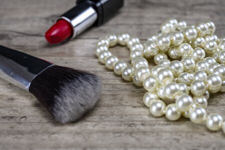 Glamorous jewellery and make up on woodの写真素材