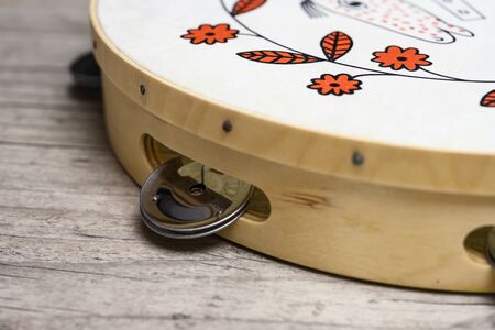 Classical percussion musical instrument tambourine on tableの写真素材