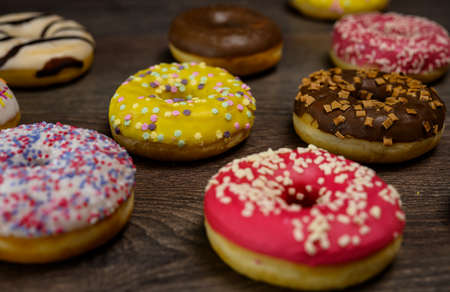 Multiple delicious donuts on table close up shotの写真素材