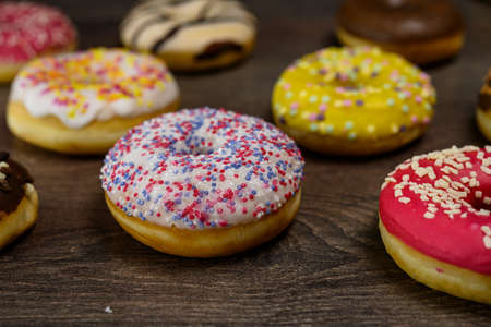 Multiple delicious donuts on table close up shotの写真素材