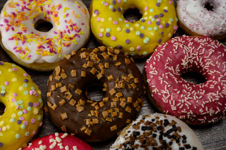 Multiple delicious donuts on table close up shotの写真素材