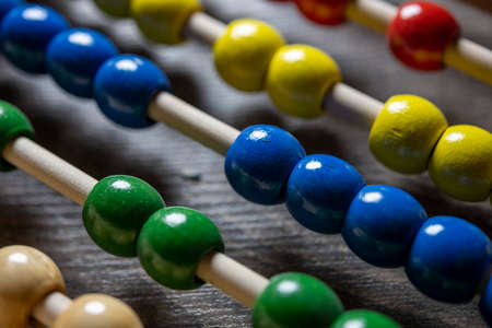 Close-up macro photo of a colorful abacus for calculationの写真素材