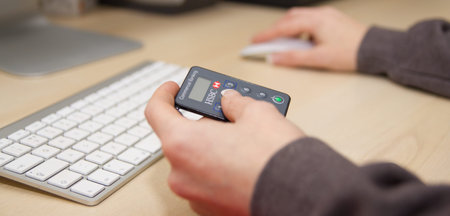 Preston, England 12/01/2017 Woman hold HSBC login device. She is about to sign in on the banking website securely.のeditorial素材