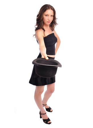 woman in a miniskirt and tube top tipping her hat set on a white backgroundの写真素材