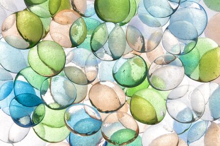 colorful background texture of backlite glass stones of different sizesの写真素材