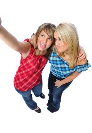 two friends posing together on a white backgroundの写真素材