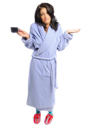 woman in a robe and slippers holding her coffee on a white backgroundの写真素材