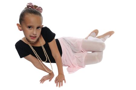 cute young girl posing in a dance costume on a white backgroundの写真素材