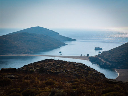 sandy isthmus is connecting two greek island (Kythnos) in the Aegean seaの写真素材