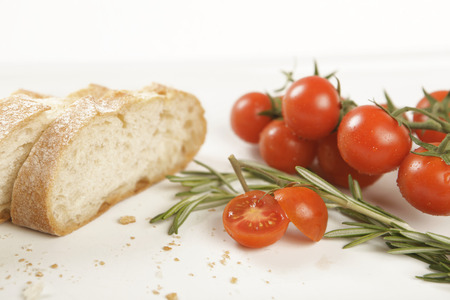 bread slices with tomato and rosemary, background close-up, blurredの写真素材