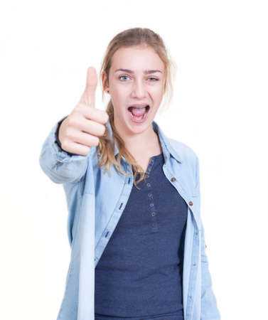 youthful girl with blond hair showing thumbs upの写真素材