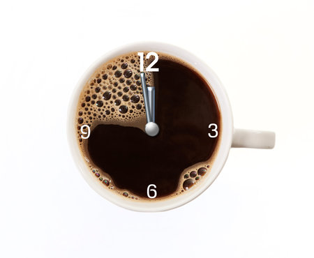 a white coffee cup with time clock shortly before twelve. isolated background