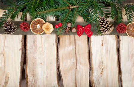a wooden background with Christmas decorationsの写真素材