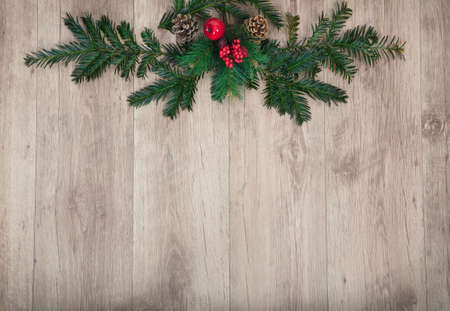 a wooden background with Christmas decorationsの写真素材