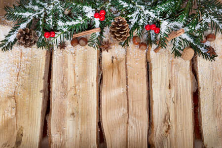 a wooden background with Christmas decorationsの写真素材