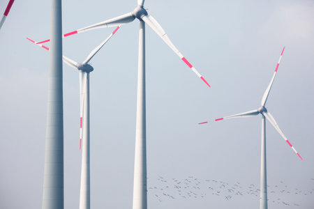 big modern wind turbines in front of blue sky