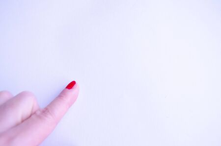 Colorful red nail finger here hand signの写真素材