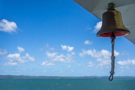 Old ship bell against a cloudy sky, Fraser Icelandの写真素材