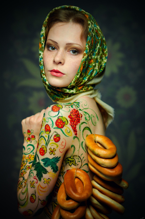 Russian nesting doll girl style in a bread-ringsの写真素材