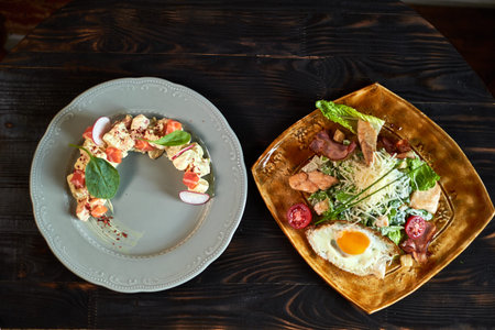 Salad with salmon and radish in the form of a month on a plate jpgの写真素材
