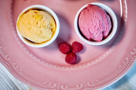 Selection of gourmet flavours of Italian ice cream in vibrant colors served in individual porcelain...
