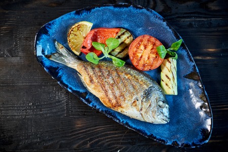 Grilled Fish dish - roasted fish and vegetables jpgの写真素材