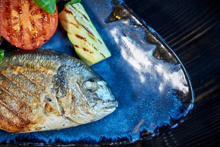 Grilled Fish dish - roasted fish and vegetables jpgの写真素材