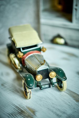 Vintage car toy standing on the shelf jpgの写真素材