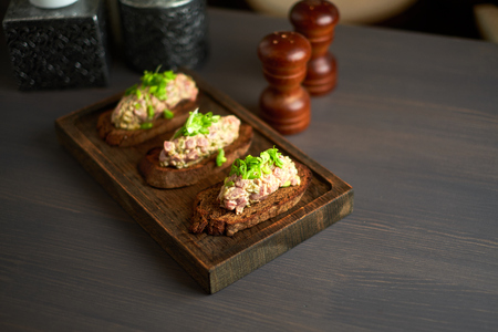 bruschetta, on slices of toasted baguette garnished with basilの写真素材
