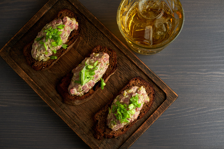 bruschetta, on slices of toasted baguette garnished with basilの写真素材