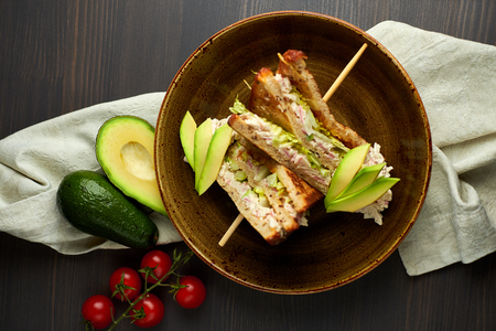 Top view of Healthy Sandwich toast with lettuce, ham, cheese and tomato on a wooden backgroundの写真素材