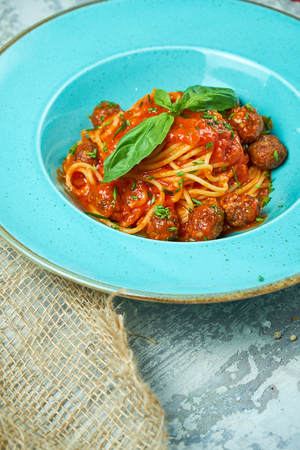 Pasta with meat balls. Beautiful serving dishes. Restaurant menuの写真素材