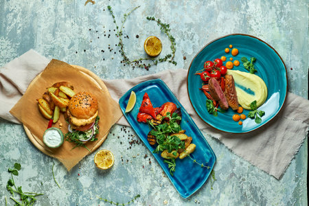Three dishes with meat burger with grilled vegetables