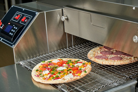 Industrial electric pizza oven for catering. Professional kitchen equipmentの写真素材