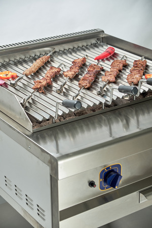 Kitchen electric grill with stones for the network catering. Professional kitchen equipmentの写真素材