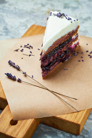 Lavender cake. Gray textured background. Beautiful serving dishes. Dessert. Food chainの写真素材