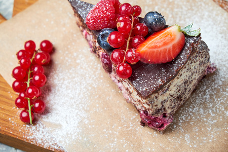 Cherry berry cake. Gray textured background. Beautiful serving dishes. Dessert. Food chainの写真素材